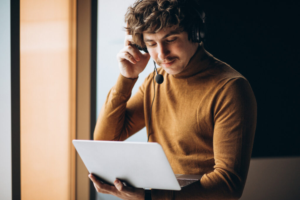 Remote interpreting services professional using headset and laptop